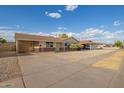 Single-story home with a covered carport, neutral exterior, and minimalist landscaping at 3632 W Mariposa St, Phoenix, AZ 85019