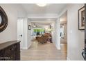 Bright foyer with hardwood floors leading to a large living room with scenic backyard views at 39 E Tam Oshanter Dr, Phoenix, AZ 85022