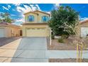 Inviting two-story home featuring a two-car garage, desert landscaping, and a well-maintained front yard at 4038 E Wagon Cir, Gilbert, AZ 85297