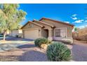 Quaint single story home features low maintenance landscaping and two car garage at 4605 W Fawn Dr, Laveen, AZ 85339