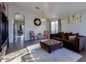 Inviting living room features sleek flooring, stylish furnishings, and neutral decor at 4605 W Fawn Dr, Laveen, AZ 85339