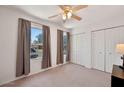 A bright bedroom includes large windows, neutral walls, and a spacious closet at 5135 E Evergreen St # 1159, Mesa, AZ 85205