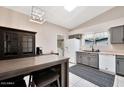 A spacious kitchen features a breakfast bar, stainless appliances, and ample cabinet space at 5135 E Evergreen St # 1159, Mesa, AZ 85205