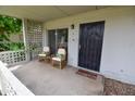 Relaxing patio space with comfortable chairs and a secure entry door, perfect for enjoying the outdoors at 5550 N 12Th St # 15, Phoenix, AZ 85014