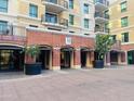 Exterior view of the building's entrance with well-maintained landscaping and architectural details at 6803 E Main St # 4415, Scottsdale, AZ 85251