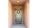 Front door features a charming wreath, providing a warm and inviting entry at 7551 W Darrel Rd, Laveen, AZ 85339