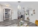 Open-concept home with wood floors, white trim, neutral colors, and pendant lighting at 941 W Dexter Way, San Tan Valley, AZ 85143