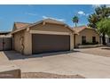 Single story home showing the garage, driveway and front entrance at 1019 W Mohawk Ln, Phoenix, AZ 85027