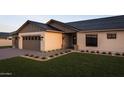 Charming single story home featuring a two car garage, desert landscaping and a covered entryway at 11203 E Crescent Ave, Mesa, AZ 85208