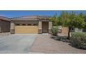 Inviting single-Gathering home with a tile roof, desert landscaping, and a two-car garage at 11625 N 153Rd Dr, Surprise, AZ 85379