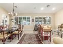 Inviting living room with ample sunlight, tile flooring, and stylish furniture at 16337 W Pierce St, Goodyear, AZ 85338