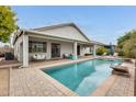 Private backyard pool with a covered patio, perfect for outdoor relaxation and entertaining at 16398 N Oachs Dr, Surprise, AZ 85374