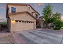 Charming two-story home featuring a well-manicured front yard, two car garage, and inviting front porch at 1721 E Cielo Grande Ave, Phoenix, AZ 85024