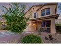 Charming two-story home featuring a well-manicured front yard, two car garage, and inviting front porch at 1721 E Cielo Grande Ave, Phoenix, AZ 85024