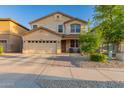 Charming two-story home featuring a well-manicured front yard, two car garage, and inviting front porch at 1721 E Cielo Grande Ave, Phoenix, AZ 85024