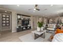 Open-concept living room with sleek decor, ample natural light, and stylish furnishings at 17650 W Bajada Rd, Surprise, AZ 85387