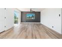 Bright bedroom with wood floors and access to a balcony and natural light at 1916 W Morningside Dr # 111, Phoenix, AZ 85023