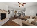 Spacious living room features wood floors, fireplace and modern design at 20121 N 76Th St # 2006, Scottsdale, AZ 85255