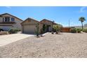 Charming single-story home featuring a two-car garage, gravel landscaping, and a desert-friendly yard at 20802 N 7Th Pl, Phoenix, AZ 85024