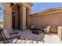 Cozy outdoor patio with seating around a fire pit, perfect for relaxing and entertaining at 27953 N 111Th Way, Scottsdale, AZ 85262