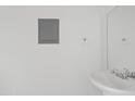 Clean bathroom featuring a pedestal sink, mirror, and neutral color scheme at 286 W Palomino Dr # 103, Chandler, AZ 85225