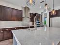 Modern kitchen boasts an island, stainless steel appliances, and custom cabinets for a chef-inspired culinary experience at 3809 E Lynx Pl, Chandler, AZ 85249