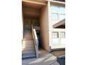 Exterior view of building with stairwell leading to the upstairs units at 5998 N 78Th St # 222, Scottsdale, AZ 85250