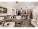 Open-concept living room showcases seamless flow to the kitchen, perfect for entertaining guests at 805 E La Palta St, Queen Creek, AZ 85140