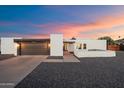 Charming single-story home featuring a modern garage, neutral paint, and desert landscaping for low maintenance at 10245 N 34Th Pl, Phoenix, AZ 85028
