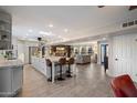 Spacious open kitchen with a large island, stainless steel appliances, and wood-look tile flooring throughout at 10245 N 34Th Pl, Phoenix, AZ 85028