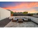 Enjoy outdoor living on this patio with comfortable seating and a cozy fire pit perfect for relaxing evenings at 10245 N 34Th Pl, Phoenix, AZ 85028