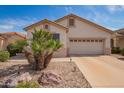 Charming single-story home with a two-car garage, low maintenance landscaping, and a neutral color scheme at 18077 W Sammy Way, Surprise, AZ 85374