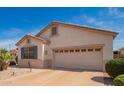 Well-maintained single-Gathering home with a two-car garage, desert landscaping, and inviting curb appeal at 18077 W Sammy Way, Surprise, AZ 85374