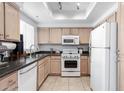 Functional kitchen with classic appliances, tile flooring, and ample cabinet space at 1825 W Ray Rd # 2132, Chandler, AZ 85224