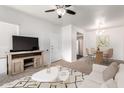 Bright living room featuring modern furniture, neutral tones, and a ceiling fan at 1825 W Ray Rd # 2132, Chandler, AZ 85224
