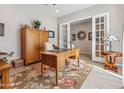 Spacious office featuring wood furniture, a ceiling fan, and bright natural light at 19045 N 269Th Dr, Buckeye, AZ 85396