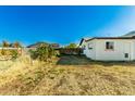 Spacious backyard featuring a grassy area and garden space, ready for landscaping and outdoor enjoyment at 214 W June Cir, Mesa, AZ 85201