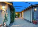 Pathway to house with stone pavers, desert plants, and overhead structure at 4008 N 85Th St, Scottsdale, AZ 85251