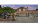 Charming two-story home featuring a two-car garage and well-maintained landscaping at 4306 E Amberwood Dr, Phoenix, AZ 85048
