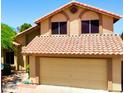 Charming two-story home featuring a two-car garage and well-maintained landscaping at 4306 E Amberwood Dr, Phoenix, AZ 85048