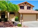 Charming two-story home featuring a two-car garage and well-maintained landscaping at 4306 E Amberwood Dr, Phoenix, AZ 85048