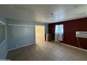 Inviting living area with tile flooring and neutral wall paint, creating a warm and welcoming atmosphere at 4310 N 42Nd Pl, Phoenix, AZ 85018