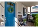 Charming entryway featuring a bright blue door adorned with a welcoming wreath and stylish decor at 4438 N 27Th St # 27, Phoenix, AZ 85016