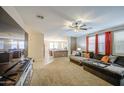 Open-concept living room featuring neutral color scheme and a spacious layout at 46057 W Dutchman Dr, Maricopa, AZ 85139