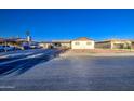 Image shows the house and yard from the street, with a low lying ranch style at 4727 N 50Th Dr, Phoenix, AZ 85031