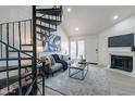 Comfortable living area with a spiral staircase, fireplace, and plenty of space at 4901 S Calle Los Cerros Dr # 237, Tempe, AZ 85282