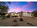 Striking modern home exterior with desert landscaping and unique architectural features at 6417 N 52Nd Pl, Paradise Valley, AZ 85253
