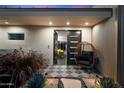 Inviting front entrance with a stylish door, modern decor, and comfortable seating at 6417 N 52Nd Pl, Paradise Valley, AZ 85253