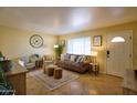 Cozy living room with warm colors, comfortable seating, and lots of natural light at 6901 E Portland St, Scottsdale, AZ 85257