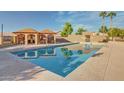 Enjoy the community pool with shaded seating areas and clear blue water, perfect for relaxation at 7977 W Wacker Rd # 253, Peoria, AZ 85381